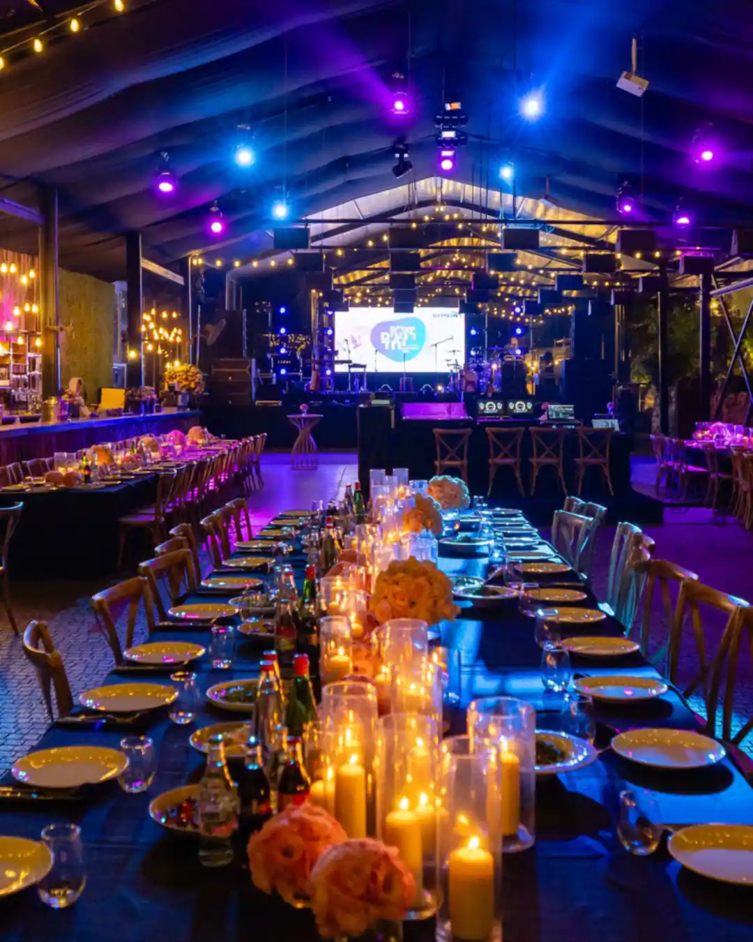 A long banquet table set for an awards night